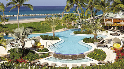 The family-friendly Four Seasons Resort Nevis features an outdoor pool, waterfront chaise lounges and private cabanas. Photo courtesy of Four Seasons Resort