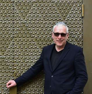 Felix Gothart, the chairman of Bayreuth's Jewish community in the Franconia region of Germany, stands in front of the doors of the renovated synagogue. Photo courtesy of Candyce Stapen.