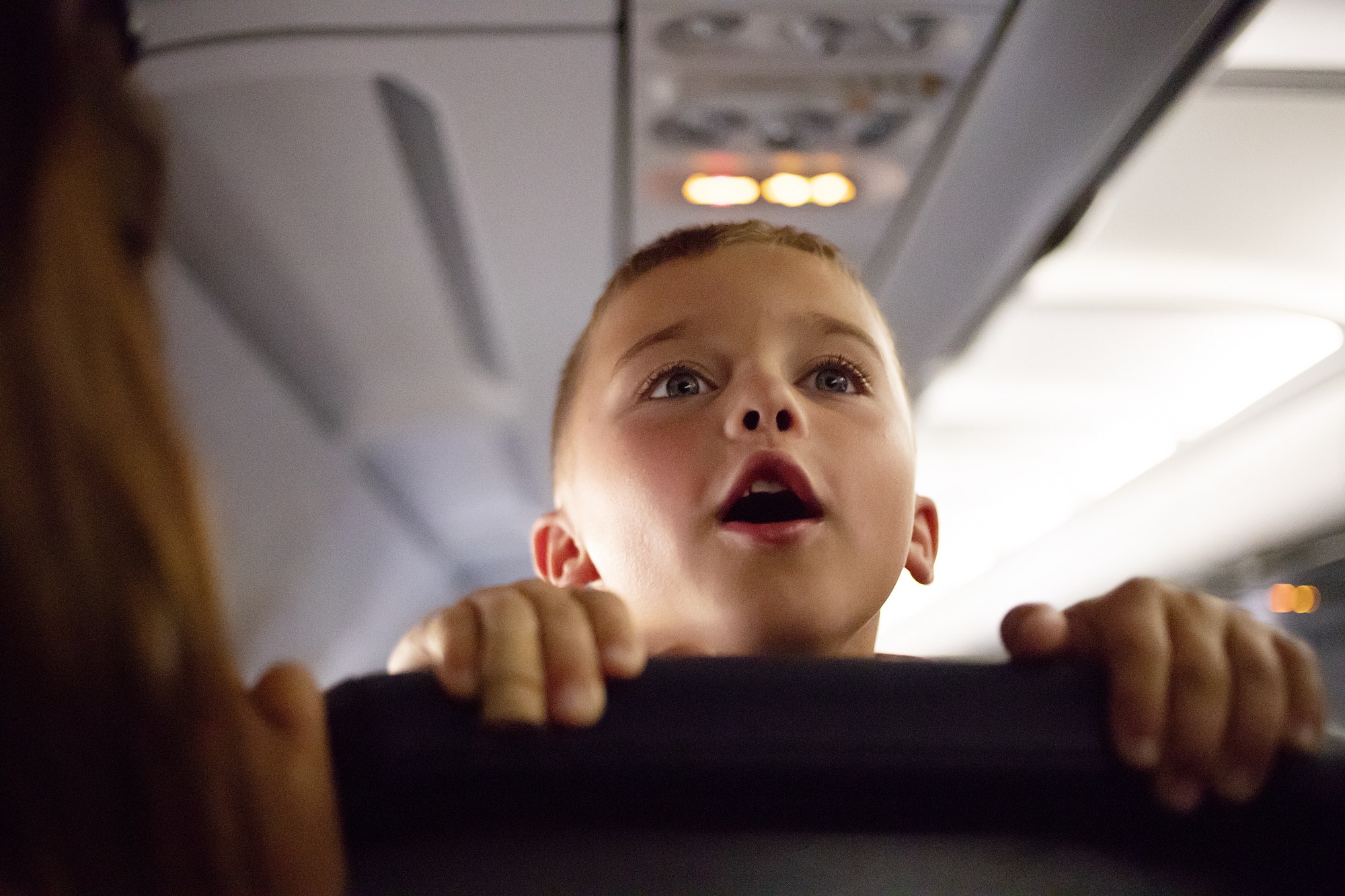 Kid on airplane talking