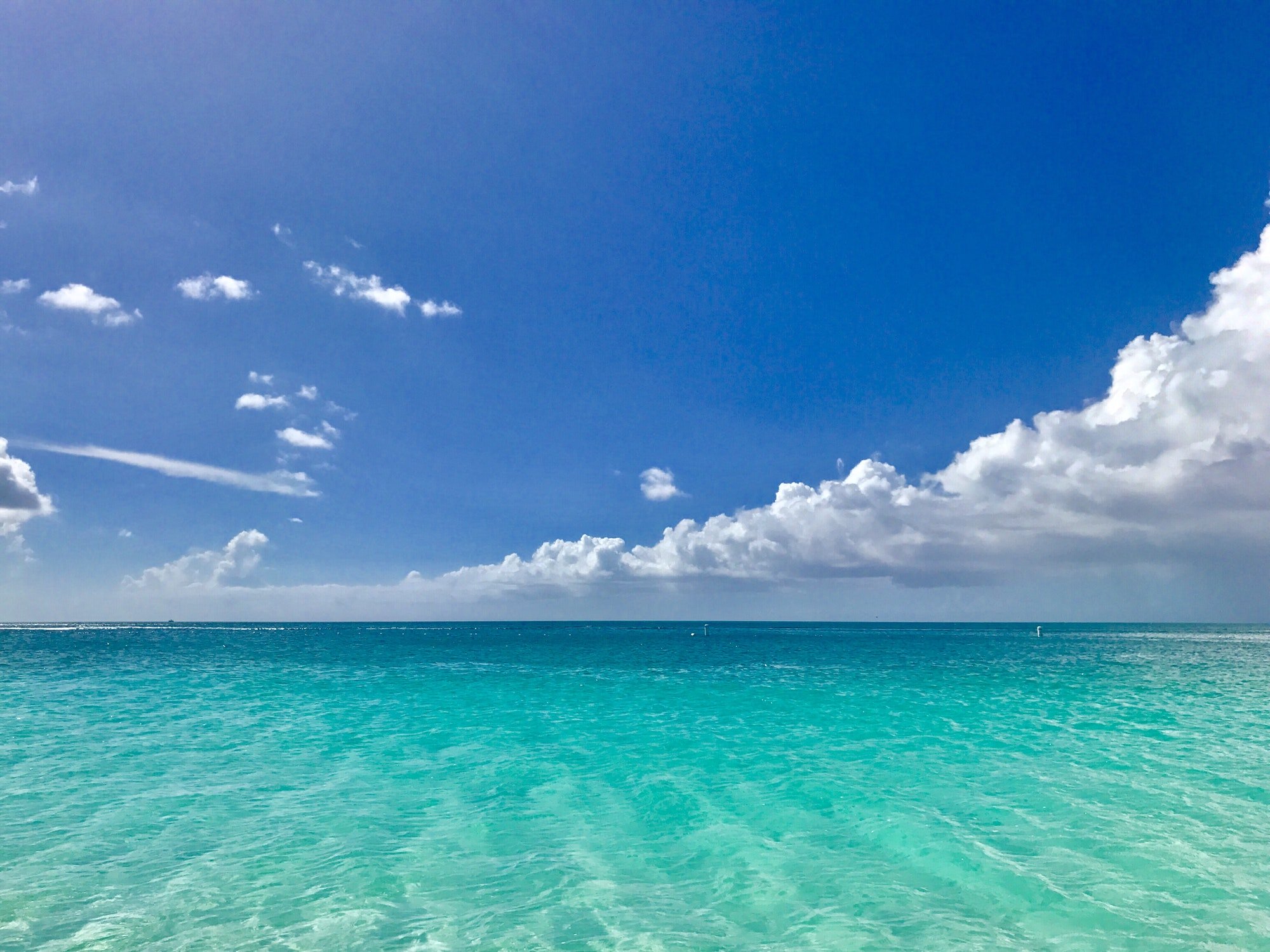 Turquoise water under the blue sky at Grace Bay, Turks and Caicos.